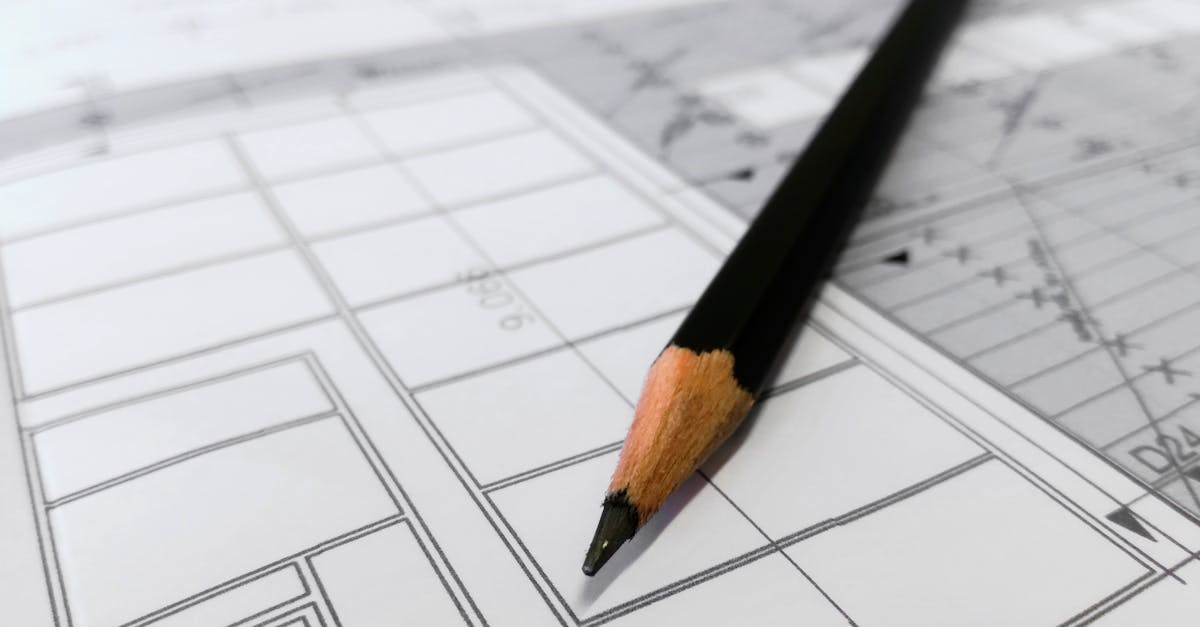 pexels-photo-268362-268362 Detailed image of a black pencil resting on architectural blueprints, ideal for design and planning themes.